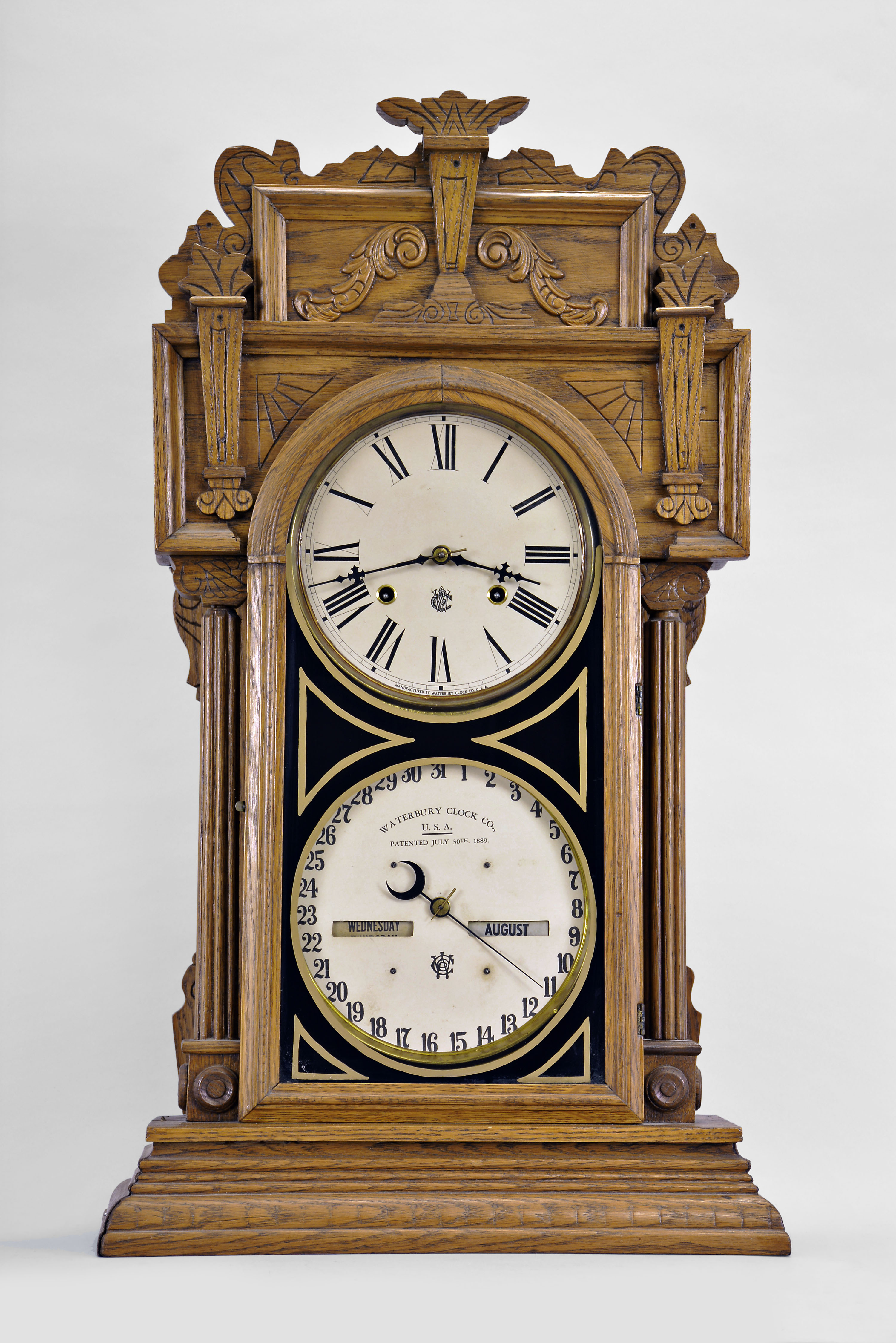 Waterbury Clock Co., Waterbury, Conn., "Calendar No. 43", 8 day, time and strike spring brass movement double dial shelf clock. — Antique Clocks Price Guide