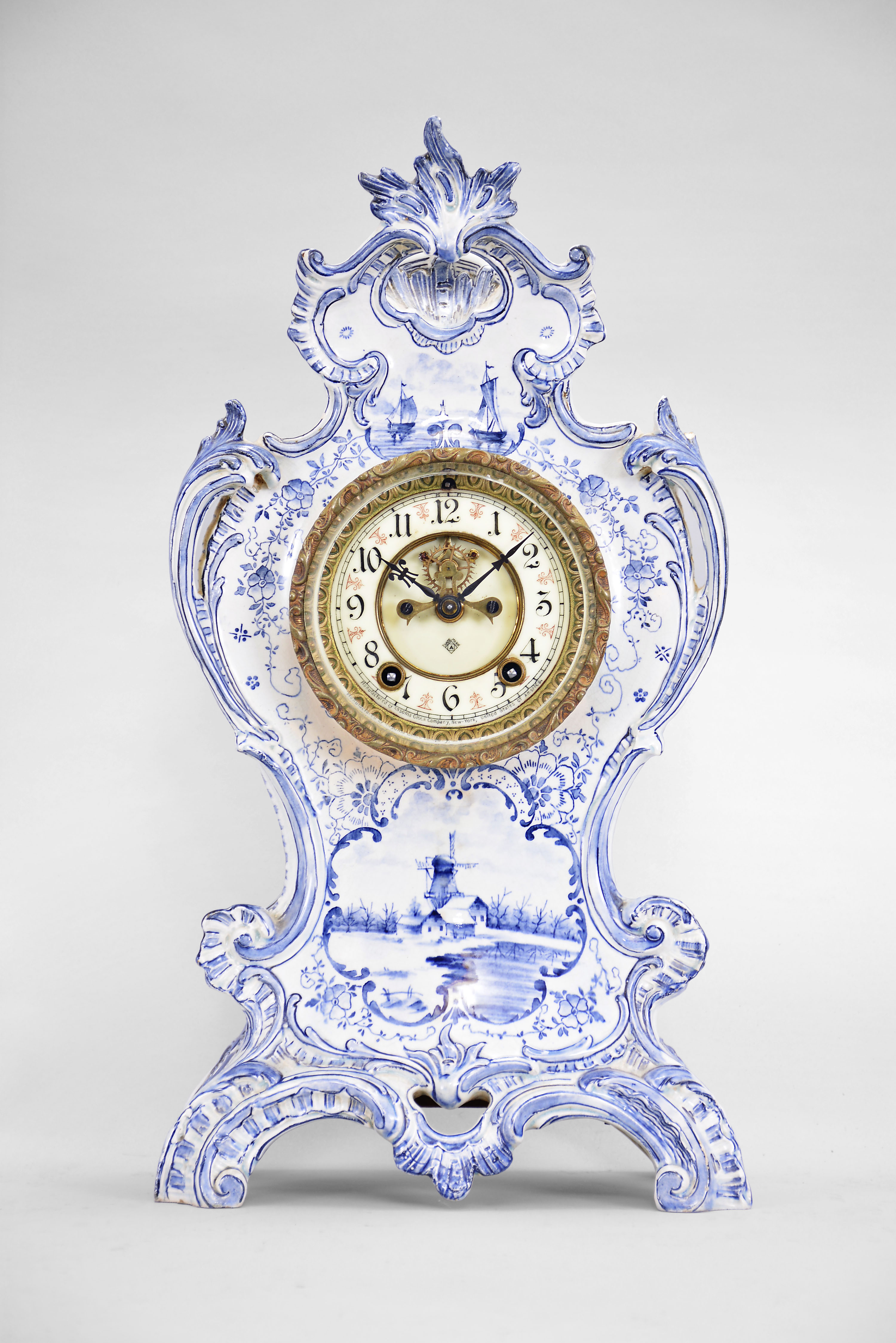 Ansonia Clock Co., New York, "La Rive", 8 day, time and strike spring brass movement Delft style porcelain shelf clock. — Antique Clocks Price Guide