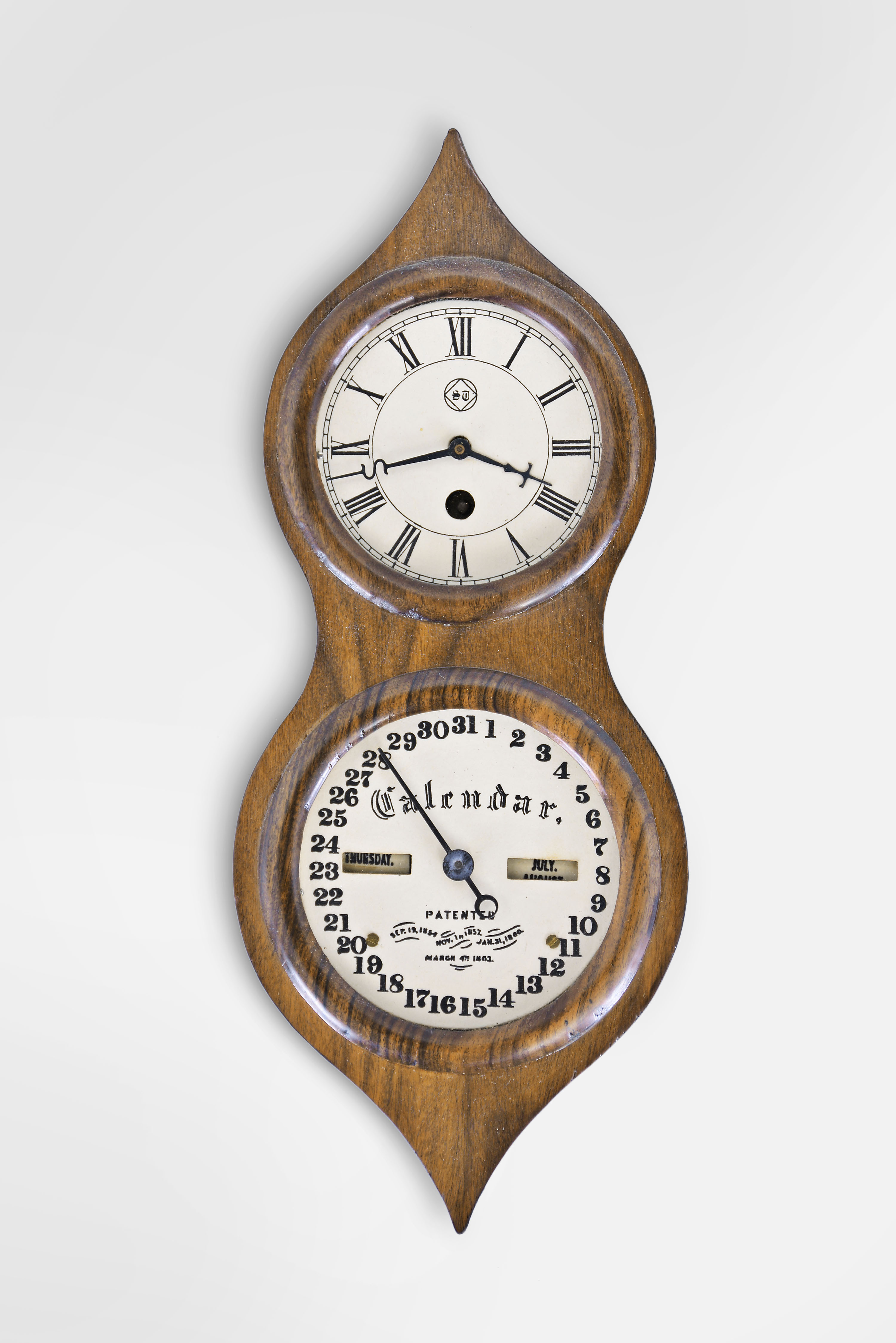 Michael Paul, Berea, Ohio, miniature reproduction, 30 hour, spring driven, pendulum movement with a working Mix Brothers calendar, copy of a Seth Thomas "Office Calendar No. 3" often called "Peanut" double dial calendar clock. This example is number 3 of 26. — Antique Clocks Price Guide
