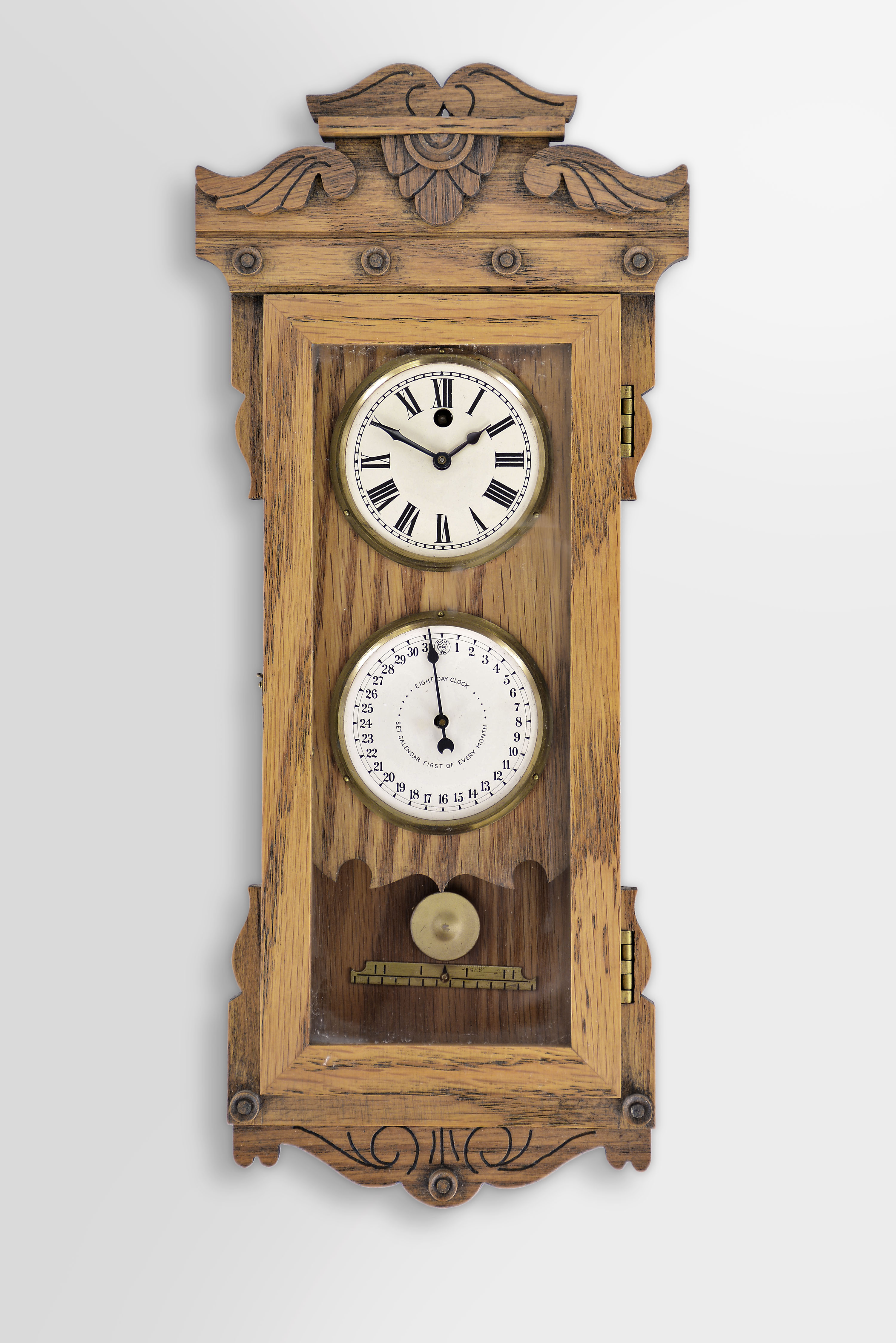 Michael Paul, Berea, Ohio, 30 hour, spring brass pendulum movement with a simple calendar miniature timepiece copy of a New Haven Clock Co. double dial calendar clock. This example is number 3 of 22. — Antique Clocks Price Guide
