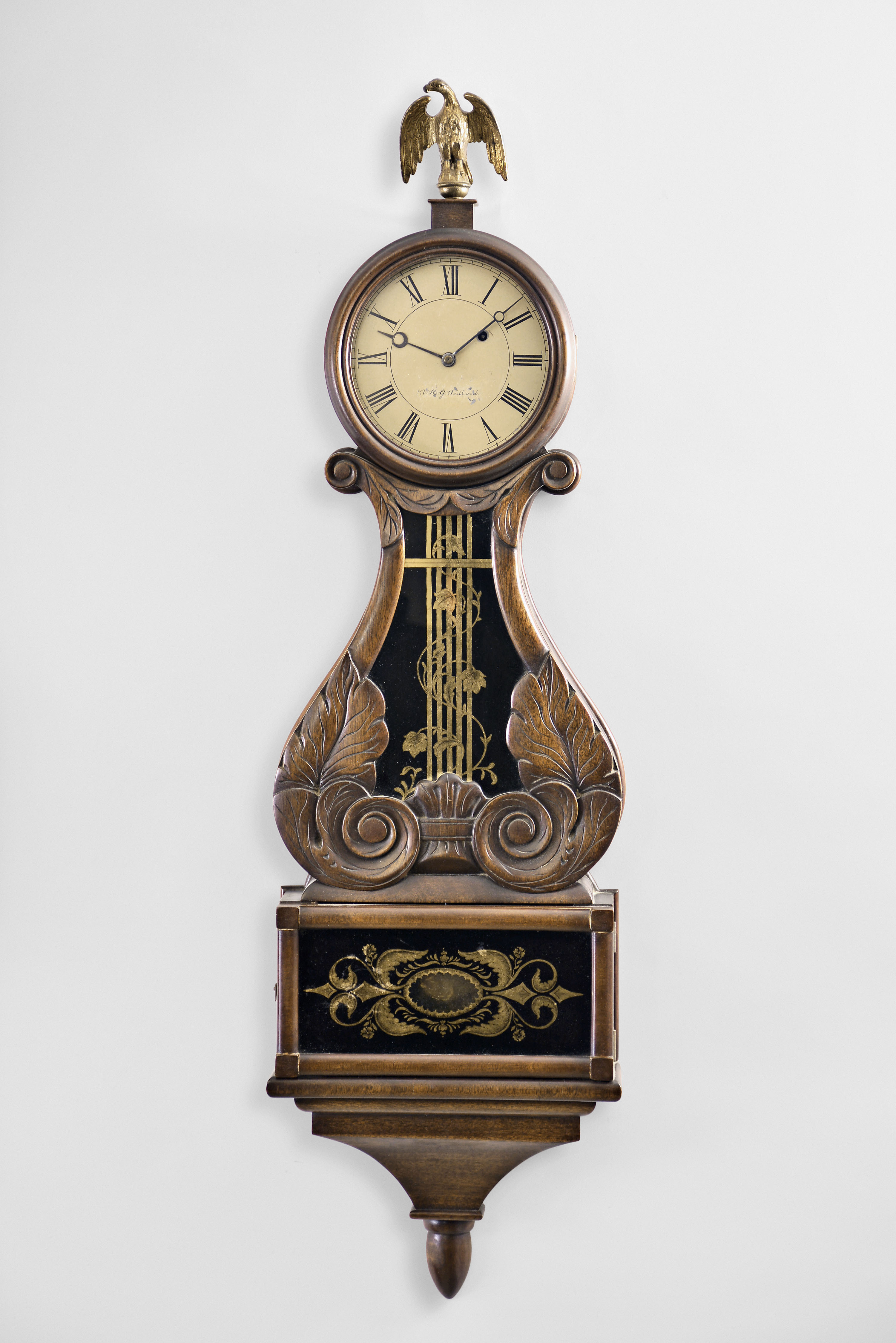 Victor H. Wadlund, 8 day, weight brass movement box lyre wall timepiece. Mr. Wadlund scratched his name into backboard and the date 1952. — Antique Clocks Price Guide