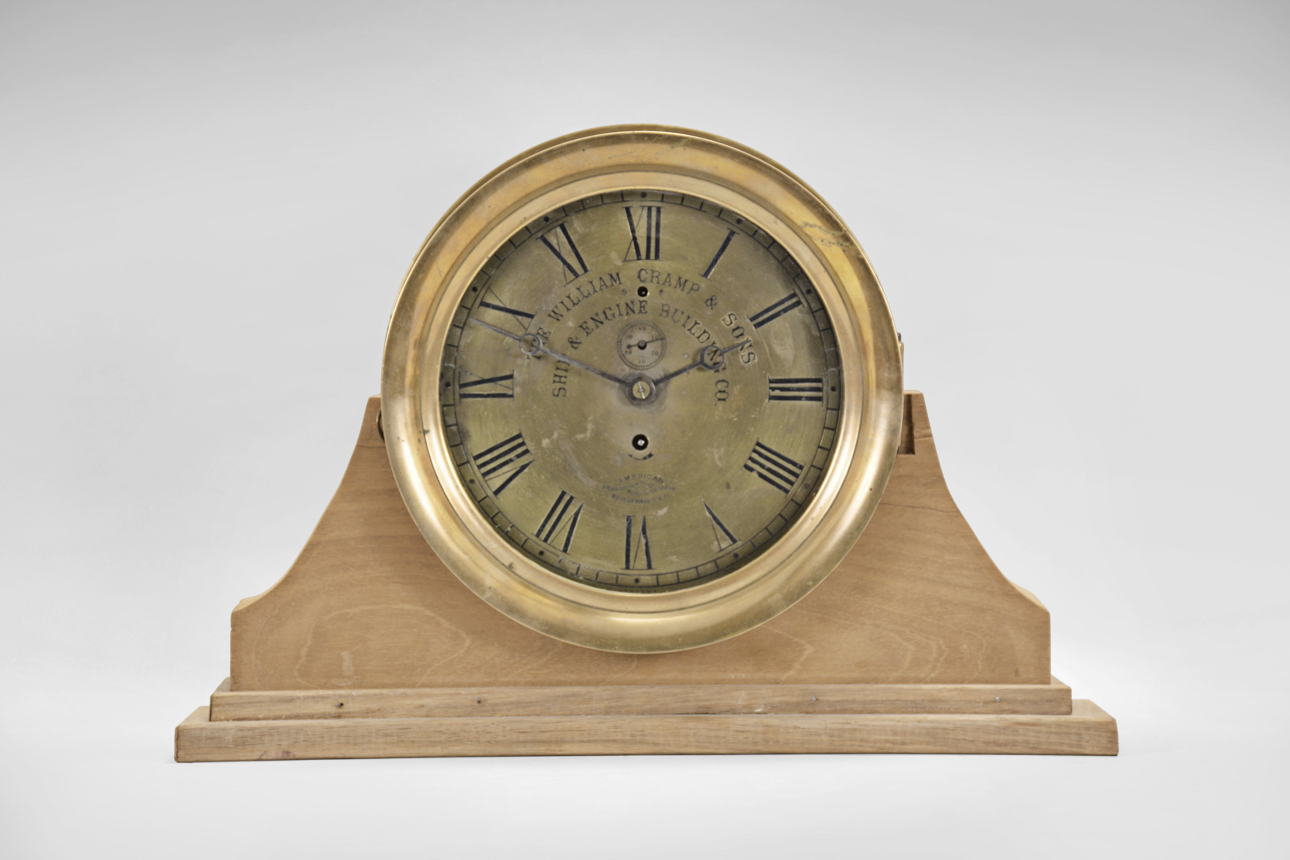 E. Howard &amp; Co., Boston, Mass., for American Steam Gauge &amp; Valve Manufacturing Co. Boston, Mass., "No. 69" style marine clock, round brass case with mounting flange, 8.5 inch Roman numeral brass dial, blued steel moon hands, signed, 8 day nickel damascened movement, serial #2117, dial #3083 NG, case #3083 — Antique Clocks Price Guide