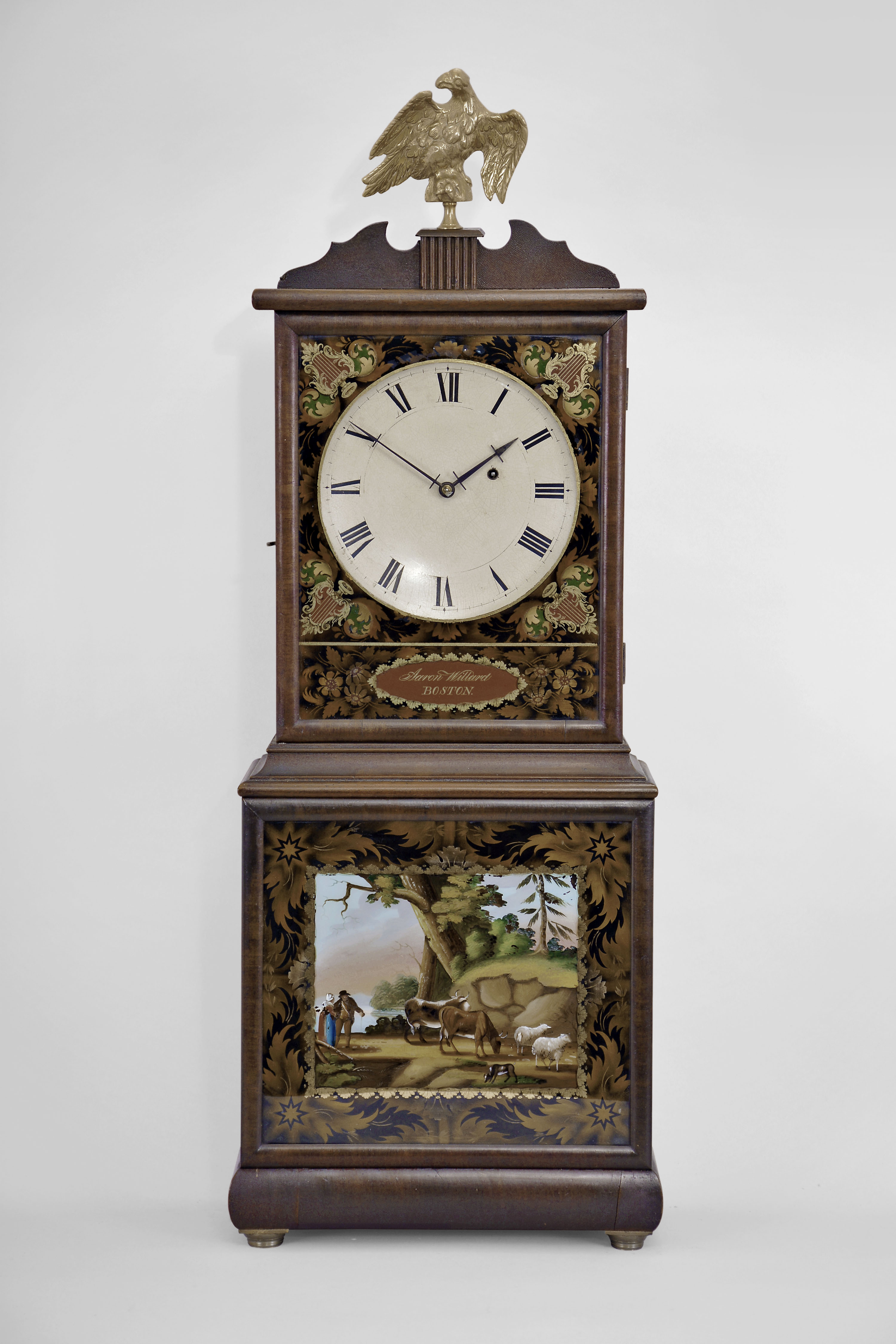Massachusetts Shelf Clock signed "Aaron Willard, BOSTON", 8 day, time only, weight driven movement in a mahogany case with painted metal dish dial with reverse painted upper and lower tablets surmounted by brass eagle finial — Antique Clocks Price Guide