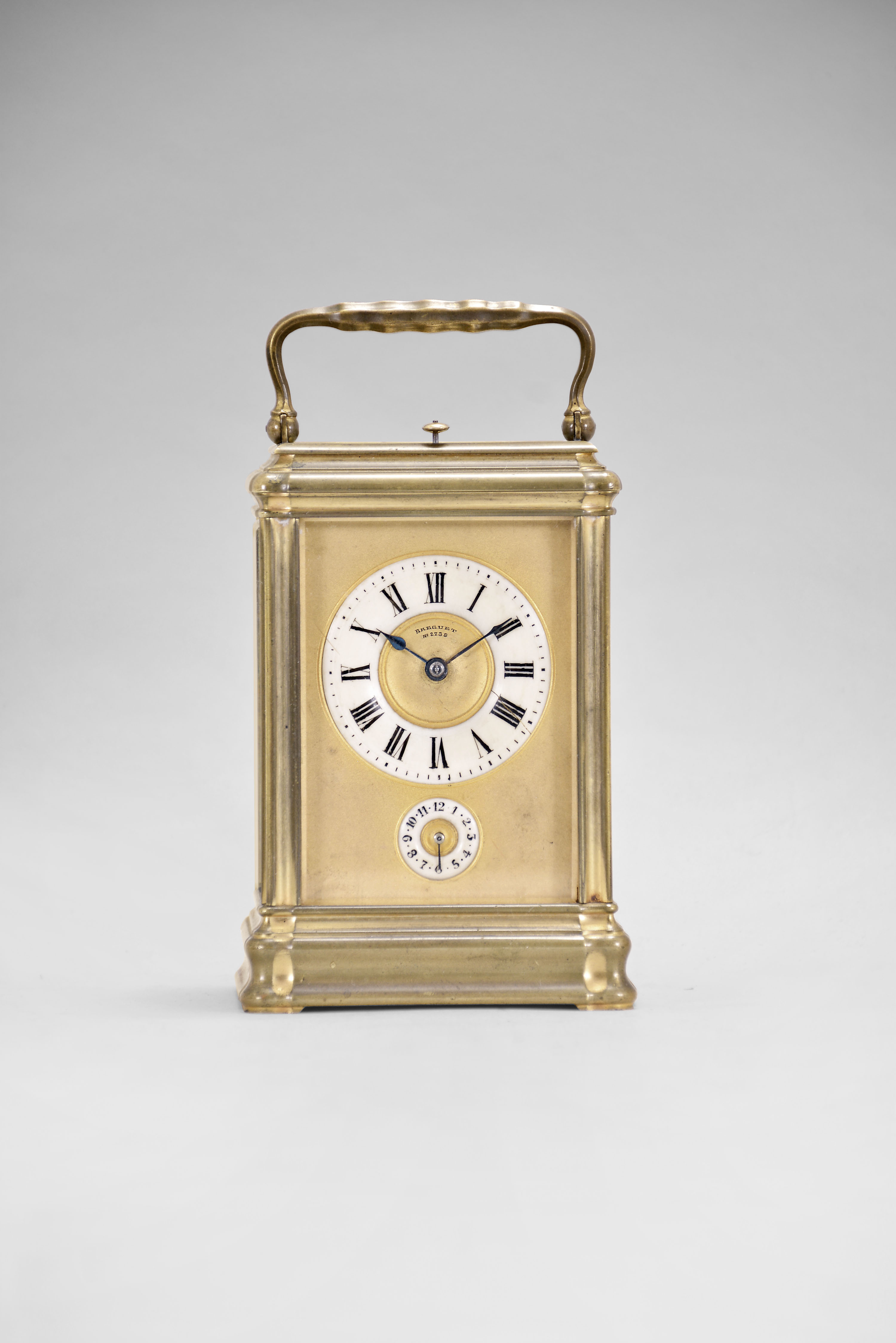 Attributed to Holingue Freres, for Breguet, 12 Rue De La Paix, Paris, a Gorge cased, grand sonnerie striking carriage clock with leather bound box, the gilt brass case set with five beveled glass panels, gilt dial mask signed "Breguet No. 2739", roman numeral ivory dial, with subsidiary Arabic numeral ivory alarm dial, blued steel hands, 8 day, three train movement with lever platform, striking the hours and quarters in passing, and repeating the last hour and quarter on demand, the base with three position lever for silence, petite sonnerie or grand sonnerie, with leather bound, velvet lined travel case, the inside of the lid with the Breguet name and address in gold, the bottom also with the Breguet mark, and "No. 2739", with original key — Antique Clocks Price Guide