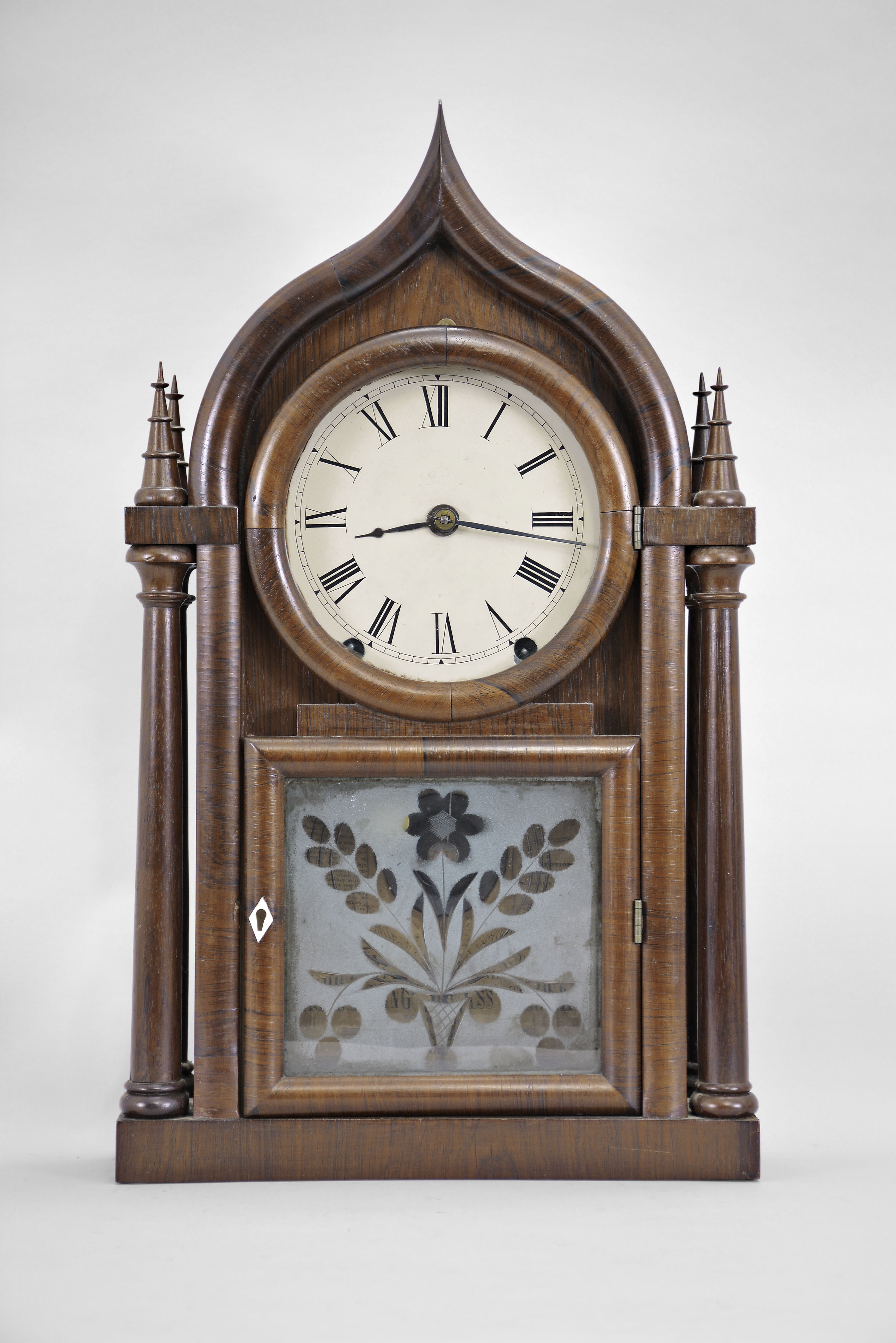 Brewster &amp; Ingraham, Bristol, Conn., 8 day, time and strike brass spring brass movement four column O.G. Gothic or onion top shelf clock. — Antique Clocks Price Guide
