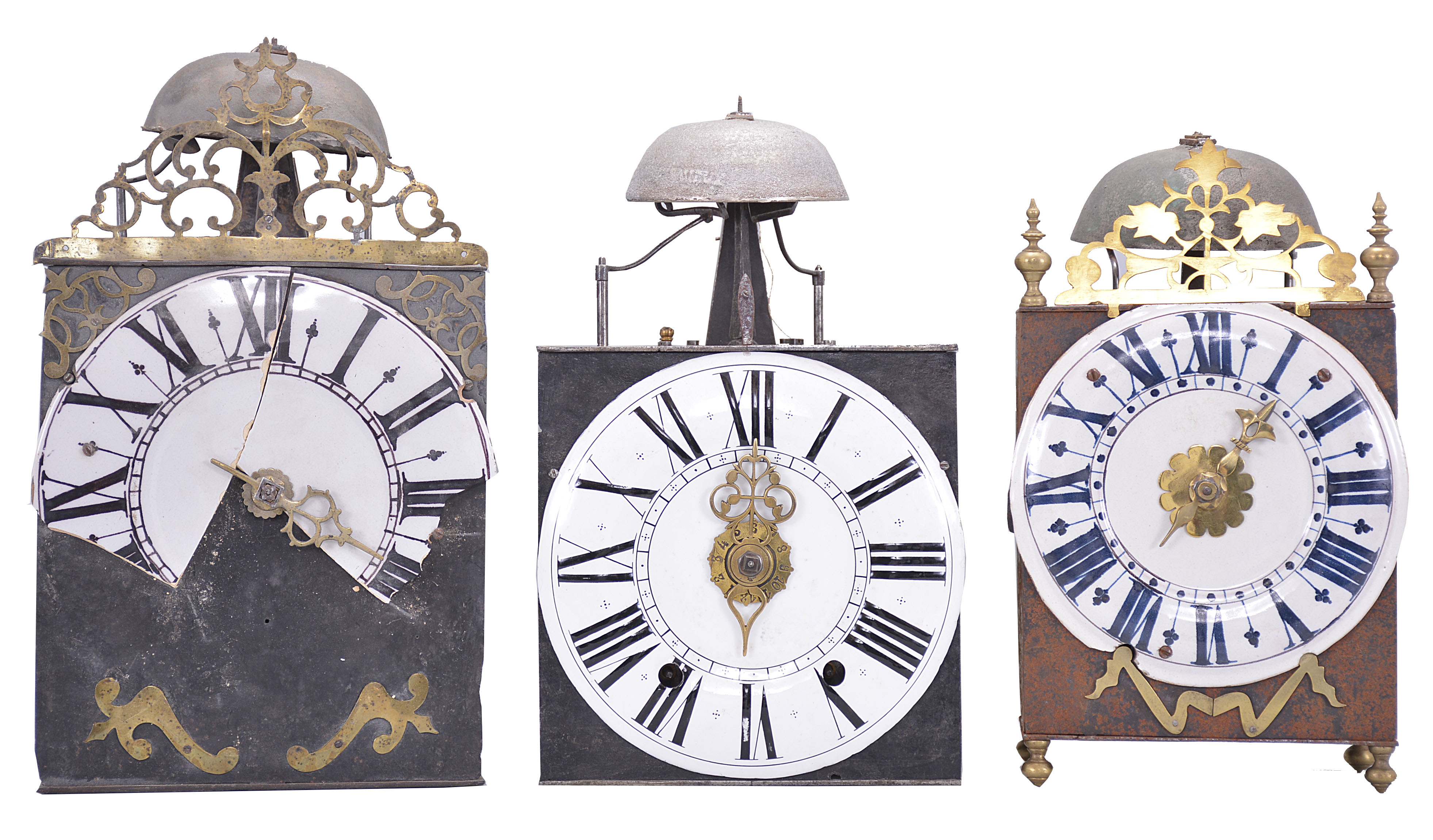 Clocks- 3 (Three) Comtoise wall clocks: (1) France, Comtoise clock, 8 day, time and strike, weight driven movement with verge escapement, thread suspension with rear-hanging pendulum in an iron post and plate frame, 9 inch faience dial with large Roman numerals, single brass hand, flat pierced brass fronton, two pivoted brass winding arbor shutters, mid 18th Century. (2) France, Comtoise wall clock, 8 day, time and strike with alarm, weight driven movement with verge escapement, thread suspension with rear-hanging pendulum in an iron post and plate frame, 8.5 inch enamel dial with flat center and convex chapter, large Roman numerals, and single brass hand, mid 18th Century. (3) France, Comtoise "lantern" clock, 8 day, time and strike, weight driven movement with verge escapement, thread suspension with rear-hanging pendulum outside the plate in an iron post and plate frame, 7.75 inch faience dial with large Roman numerals in dark blue, single brass hand, resting on turned brass feet, topped by flat brass fronton flanked by two turned brass finials, two pivoted brass winding arbor covers, mid 18th Century. — Antique Clocks Price Guide