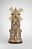France, industrial series windmill, 8 day timepiece and barometer, spring driven movement in a gilt and silvered brass case with black slate base, mid section with pierced railing, lower section with two simulated windows flanking a door, the door opening to access the windmill movement winding arbor, front with clock and barometer dials, the sides with Fahrenheit and Celsius thermometers.
