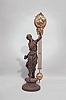 Ansonia Clock Co., New York, "Juno" figural swinging clock, 8 day, time only, spring driven movement mounted inside a nickel plated brass sphere with cast ribbon ornament and applied Arabic numerals, with Louis XV style hands, all supported by patinated spelter figure of a Roman goddess standing atop a cast spelter pedestal.