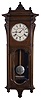 Seth Thomas Clock Co., Thomaston, Conn., "Marcy", wall clock, 8 day, time and quarter strike, spring driven movement in a walnut case with a painted metal dial and damascened nickel pendulum bob
