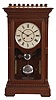 Seth Thomas Clock Co., Thomaston, Conn., "Garfield" shelf clock with a weight driven, 8 day, time and strike cathedral gong movement in a walnut case.