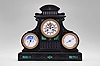 France, monumental mantel clock, 8 day, time and strike, spring driven movement with triple calendar, moon phases and barometer in a black slate case with green malachite insets and incised gold highlights. All dials are white enamel and the clock has exposed Brocot escapement on center dial.