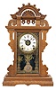 Seth Thomas Clock Co., Thomaston, Conn., "Eclipse", 8 day, time, strike and alarm spring brass movement walnut case mantel clock.