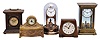 Clocks- 5 (Five) Desk: (1) Junghans, Germany, alarm clock, 30 hour, time and alarm, spring driven movement in a molded wood case; (2) Seth Thomas, Conn., desk clock, 30 hour, spring driven movement in a mahogany case with banding; (3) Connecticut, bedside clock, 30 hour, spring driven movement in a cast metal case with jewelry tray; (4) and (5) Tiffany electromechanical clocks with torsion pendulums in metal and glass cases.