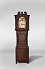 Hardy and Marsh, 51 New St, Birmingham, England, 8 day, time and bell strike, weight driven movement tall clock in mahogany case with rope turned full columns flanking hood and trunk door. The painted metal dial has moon phase, seconds bit and calendar.