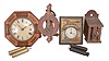 Clocks- 6 (Six) European wall: (1) Carl Mazek, Hannover, Germany; R/A wall clock, 8 day, time and strike, spring driven movement; (2) Gustav Becker, Freiberg, Germany, Vienna regulator, 8 day, time and strike, weight driven movement, c1920; (3) Germany, wag on the wall, 30 hour, weight driven wood plate movement with a wood dial and octagonal bezel; (4) Germany, wag on the wall, 30 hour, weight driven movement with an embossed brass dial surround; (5) Germany, wag on the wall movement, 30 hour, weight driven with wood plates; (6) Buamann LTD, Switzerland, wooden works novelty wall clock, weight driven movement with interesting pin wheel escapement.