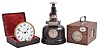 Clocks- 3 (Three) :(1) Jundes, Germany, pigeon timer clock, time and elapsed time recording on paper tape for 18 birds in a finger jointed oak case, c1930; (2) The Thompson Stamp Co., New York, time stamp clock, in cast iron case, c1925; (3) American Waltham Waltham Watch Co., Waltham, Mass., gaslight clock, 30 hour, time only, in a fitted velvet-lined case, c1890.