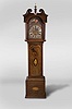 Ri. Deeble, Cork, Ireland, tall clock, 8 day, time and strike, weight driven movement in an inlaid mahogany case with broken arch top, dentil molding, carved rosettes and rope twist columns flanking hood over inlaid trunk door and base. The brass dial has calendar, silvered chapter ring, cast corner spandrels and moon phase.