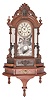 Clocks- 2 (Two): (1) Ansonia Clock Co., New York, "Triumph" mirror-side shelf clock, 8 day, time and strike, spring driven movement in a walnut case with modern shelf matching the clock's base, c1890; (2) New Haven Clock Co., New Haven, Conn., "Vistula" parlor clock, 8 day, time and strike, spring driven movement in a walnut case with painted metal dial, c1885.