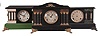 Clocks- 7 (Seven) Mantel: 8 day, time and strike, spring driven black painted wood mantel clocks by makers such as Sessions, Ingraham, and Waterbury. Also included is a French mantel clock with mahogany case, white enamel dial, and Japy Freres movement.