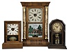 Clocks- 3 (Three): (1) E.N. Welch, Forestville, Conn., "Column" shelf clock, 30 hour, time and strike, weight driven movement in a rosewood veneer case, c1872; (2) Seth Thomas Clock Co., Thomaston, Conn., "Cottage" clock, 30 hour, time and strike with alarm, spring driven movement in a rosewood veneer case, c1880; (3) E. Ingraham, Bristol, Conn., "Baltic, 8 day, time and strike, spring driven movement in a grain painted wood case, c 1880.