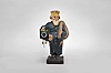 Karl Griesbaum, Triberg, Germany, "Father Christmas" whistling figure, spring driven brass movement driving air bellows, a slide whistle, and head motion, all enclosed in hand carved wooden figure depicting a bearded man carrying a sack over his shoulder, a German wall clock under his other arm, with packages and an elf in the pockets of his long coat.
