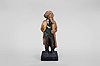 Karl Griesbaum, Triberg, Germany, "Surgeon" whistling figure, spring driven brass movement powering air bellows, a cam-driven slide whistle, and swinging head motion, all within a hand carved wooden figure depicting a bespectacled man in a long coat holding knife in one hand while whistling a tune.