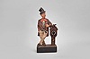 Karl Griesbaum, Triberg, Germany, "Drunkard" whistling figure, spring driven brass movement powering a bellows, a cam-driven slide whistle, and head turn motion, enclosed within a hand carved wooden figure of a man in a top hat leaning on a small working clock, a bottle tucked in his hip pocket.