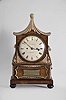 England, Des Granges, Cockspur St., mantel clock, 8 day, time and strike with pull repeat, spring driven fusee movement in a rosewood veneered case with Chinoiserie style on turned and carved feet, the case with applied and carved gilt ornaments and crest, signed dial, black steel fleur-de-lis hands, and plaque with poem considering the transient nature of life.