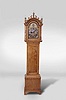 Tall clock, 8 day, time and strike, weight driven English movement in a tiger maple Norwich-style "whale's tails" fretwork and scalloped skirt case ogee foot modern case by Robert Materne of Bristol, RI. Period movement fitted with a modern brass dial affixed to wood with a name boss inscribed Paul Rogers, Berwick (Maine) .