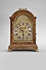 Alexander Farquharson, Edinburgh, Scotland, a mid 18th century mahogany bracket clock with date and alarm, molded base on brass bracket feet, door with brass beads at sides, and brass molded light, break arch molded top with carrying handle, the sides with brass fishscale fretsbrass composite dial with silvered, roman numeral chapter ring, matted center with date aperture above 6:00, and cutour to view mock pendulum below 12:00, and arch with silvered brass panel engraved with the makers name and location, pierced blued steel hands, 8 day fusee movement with five pillars, engraved back plate, recoil escapement, and striking on a bell