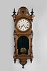 E. N. Welch weight driven wall clock, 8 day, time only, in a walnut case,