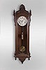 Seth Thomas Clock Co., "Regulator No. 16" hanging jeweler's regulator, 8 day, time only, weight driven movement with Graham dead beat escapement and sweep seconds in a carved walnut case with burl walnut highlights and painted metal dial