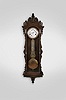 Ansonia Clock Co., New York, New York, "Regulator No. 14" hanging jeweler's regulator, 8 day, time only, weight driven Swiss movement with gridiron lyre pendulum and pinwheel escapement in a carved walnut and burl walnut case with white enamel dial and center sweep seconds
