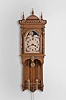 Seth Thomas Clock Co., Thomaston, Conn., "Jupiter" hanging clock with a weight driven 8 day time and strike (cathedral bell) lyre movement with a moon phase dial in an open well oak case.