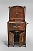 Mira Floor Standing Music Box by Mermod Freres, Ste-Croix, Switzerland, playing 18" discs on a double comb movement with two sliding dampers in a mahogany case decorated with tinted gold and silver leaf foliate transfers, with brass handles over two doors with storage for discs, all resting on slipper feet