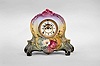 Ansonia Clock Co., New York, "La Riviere" mantel clock, 8 day, time and strike, spring driven movement with visible Brocot escapement in a polychrome porcelain Royal Bonn case with vibrant floral design.
