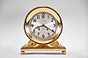 Chelsea Clock Co., Boston, Mass., "Constitution" shelf clock for J.E. Caldwell with six inch dial, polished brass case on an incurved base with ball feet, signed Arabic numeral silvered special dial with applied numerals also marked "Ships Bell", blued steel hands, 8 day, time and strike movement with lever escapement, serial #131632 matching on bottom and base and movement including Chelsea marked key