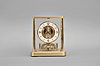 Jaeger-LeCoutre, Switzerland, "Atmos" clock, 13 Jewel, caliber 540 movement, gilt torsion pendulum, round white painted dial with applied gilt numbers and hour markers, gilt hands, all contained within a glazed rectangular case with flip-front door, movement serial number 630240.