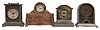 Clock- 10 (Ten) novelty: a variety of small clocks in metal cases by Waterbury, New Haven, and others. Clocks include a jewelry box clock, a New Haven "Arch Top Wee-Wag", and a clock displaying multiple time zones which commemorates the Merchant Marine Act of 1928.