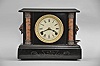 Loheide Manufacturing Co., St. Louis, Missouri, "Wizard" 8 day, time and strike spring brass lever movement black mantel clock / trade stimulator.