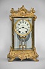 Seth Thomas Clock Co., Thomaston, Conn,, "Empire No. 10" crystal regulator with a spring driven 8 day time and half hour strike movement in a polished metal case, gilded and laquered.