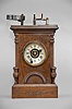 Ansonia Brass & Copper Co., Ansonia, Conn., 30 hour, time and alarm spring brass movement Davies Patent Matchstick Illuminated Alarm novelty shelf clock. The clock case and movement were made Ansonia and Henry J. Davies made the illumination part of the clock. A rare clock to find, particularly complete.