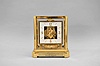 Jaeger-LeCoultre, Switzerland, "Atmos" clock, caliber 528, 15 jewel movement, gilt torsion pendulum, square white dial with applied gilt Arabic numerals and arrow markers, gilt hands, all within a glazed rectangular case with removable front panel, serial number 434180.