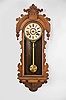 Ansonia Clock Co., New York, "Queen Isabella" wall hanging clock with a spring driven 8 day time and half hour strike in a walnut case.