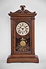Seth Thomas Clock Co., Thomaston, Conn., "Greek VP" shelf clock with a spring driven 8 day time and strike lyre movement in a walnut case.