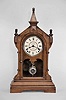 Seth Thomas Clock Co., Thomaston, Conn., "Lafayette" shelf clock with a spring driven 8 day time and strike (cathedral gong) lyre movement in a walnut case.