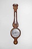 Vanini and Montini, Peterborough, England, wheel or banjo barometer with alcohol thermometer, in an inlaid mahogany veneered case with silvered dial and brass indicator knob.