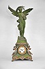Ansonia Clock Co., New York, "Sibyl and Gloria" mantel clock, 8 day, time and strike, spring driven movement in a two-piece case featuring two putti flanking the white porcelain dial in the center of the base, the top with a large winged female figure holding a lyre.