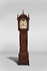 Simon Willard, Roxbury, Mass., tall clock, 8 day, time and strike, weight driven movement in typical Roxbury style mahogany case with three brass finials including center eagle finial, fretted crest, stop fluted full columns with brass capitals flanking hood and trunk doors resting on ogee bracket base. The painted metal 12-in dial by Wilson of Birmingham as found on many Willard clocks of this period is signed "Simon Willard" in script has seconds bit, calendar and scene of woman dancing in arch.