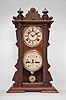 Waterbury Clock Co., Waterbury, Conn., "Calendar No. 40" shelf clock with a spring driven 8 day time and half hour strike movement in a walnut case.